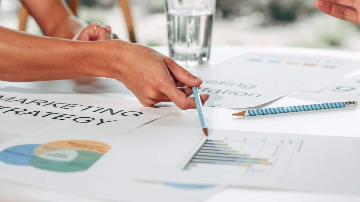 An operator planning an advertising structure in a notebook