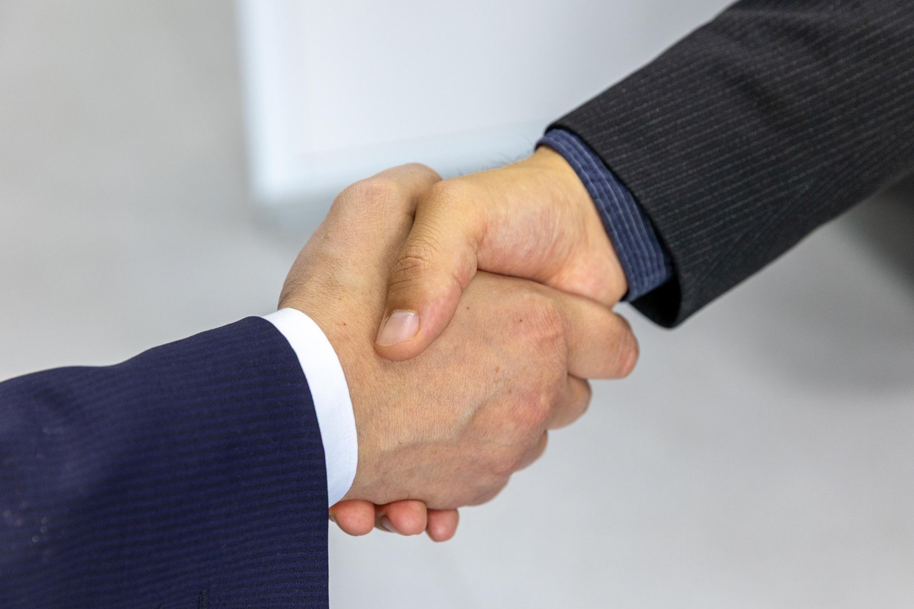 A seller comparing two Amazon agency options, AMZBoost and My Amazon Guy, to choose the right partner for their brand in 2026